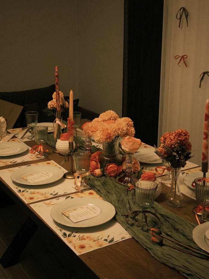 why-choose-us Elegant table setup with floral decorations and candles, perfect for a cozy celebration.